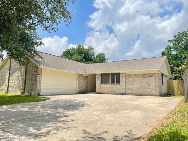 11411 Meadow Joy Dr, Houston, TX 77089 - ranch-style house with brick siding, fence, driveway, and a garage