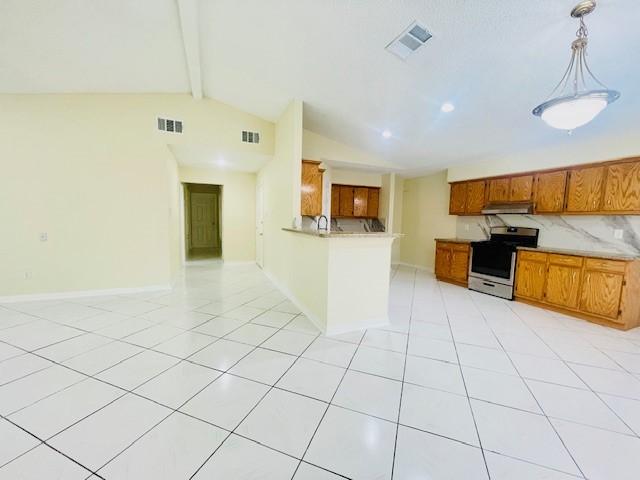 11411 Meadow Joy Dr, Houston, TX 77089 - kitchen featuring under cabinet range hood, visible vents, vaulted ceiling with beams, brown cabinetry, and stainless steel range