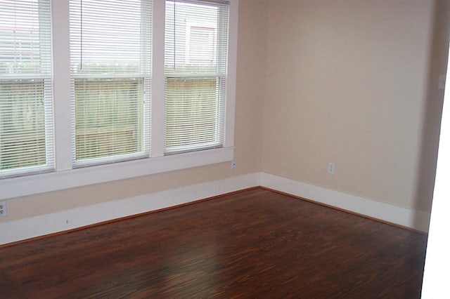 4620 Oak Ridge St, Houston, TX 77009 - empty room with baseboards and dark wood-style floors