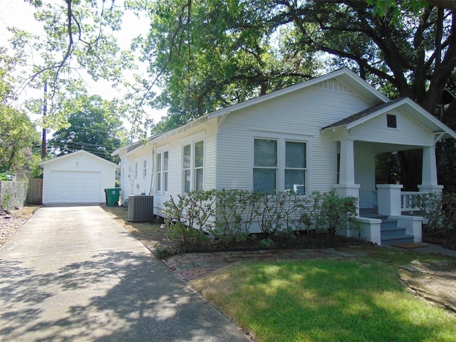 4620 Oak Ridge St, Houston, TX 77009 - view of front of property with a porch, central AC unit, a detached garage, an outdoor structure, and concrete driveway