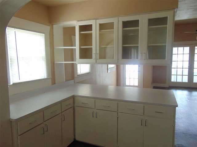 4620 Oak Ridge St, Houston, TX 77009 - kitchen featuring light countertops, arched walkways, and a wealth of natural light