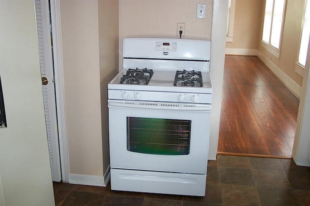 4620 Oak Ridge St, Houston, TX 77009 - room details featuring white gas range and baseboards