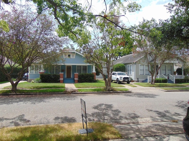 4620 Oak Ridge St, Houston, TX 77009 - view of front of house featuring covered porch and a front yard