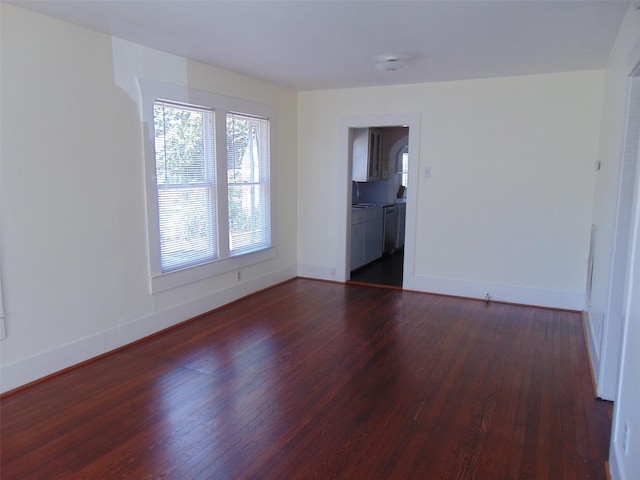 4620 Oak Ridge St, Houston, TX 77009 - empty room featuring baseboards and dark wood-style floors