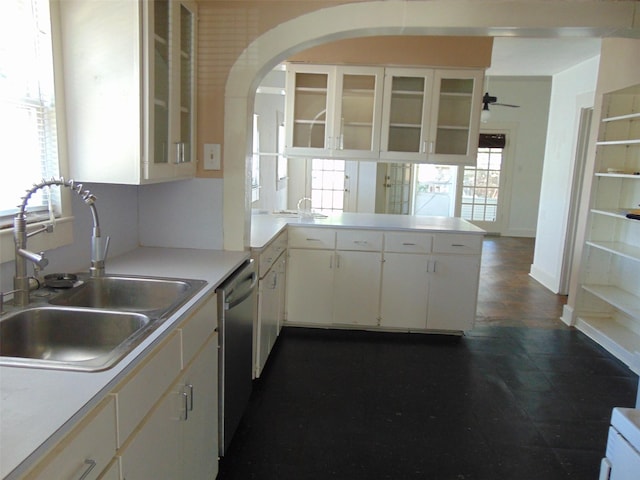 4620 Oak Ridge St, Houston, TX 77009 - kitchen featuring dishwasher, a sink, light countertops, white cabinets, and a peninsula