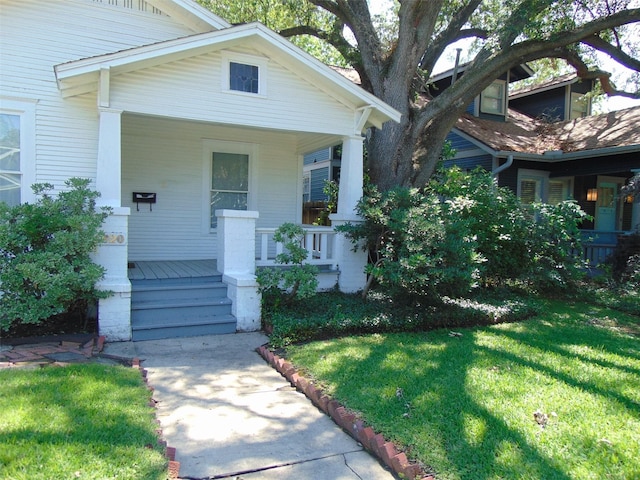 4620 Oak Ridge St, Houston, TX 77009 - view of front of house featuring a porch and a front lawn