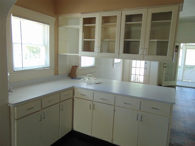 4620 Oak Ridge St, Houston, TX 77009 - kitchen featuring light countertops, a peninsula, and a wealth of natural light