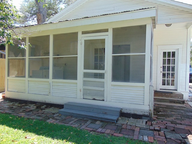 4620 Oak Ridge St, Houston, TX 77009 - view of side of home with a sunroom, metal roof, and entry steps