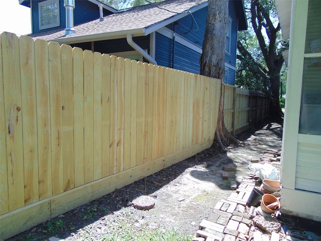 4620 Oak Ridge St, Houston, TX 77009 - view of side of home with fence and a shingled roof