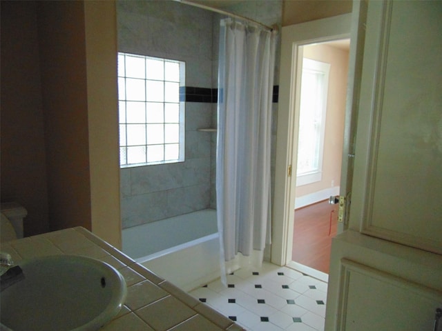4620 Oak Ridge St, Houston, TX 77009 - full bath featuring shower / bathtub combination with curtain, a sink, and tile patterned flooring