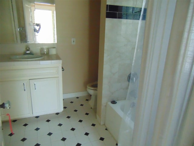 4620 Oak Ridge St, Houston, TX 77009 - bathroom featuring vanity, baseboards, tile patterned floors, and toilet