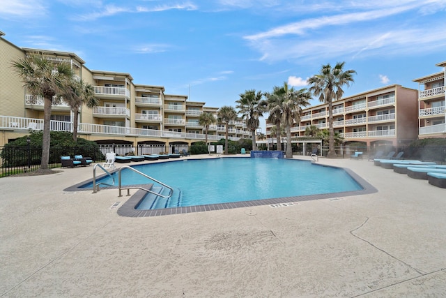 6300 Seawall Blvd Unit 9104, Galveston, TX 77551 - community pool with fence and a patio