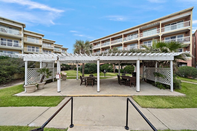 6300 Seawall Blvd Unit 9104, Galveston, TX 77551 - surrounding community with a pergola, outdoor dining area, and a patio area