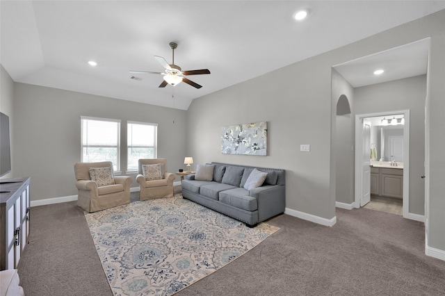 15534 Ponderosa Bend Dr, Cypress, TX 77429 - living area with arched walkways, carpet, baseboards, and ceiling fan