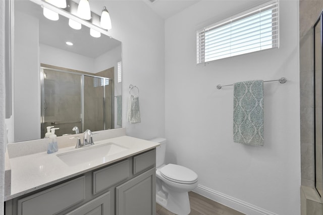 15534 Ponderosa Bend Dr, Cypress, TX 77429 - full bath featuring toilet, a tile shower, baseboards, wood finished floors, and vanity