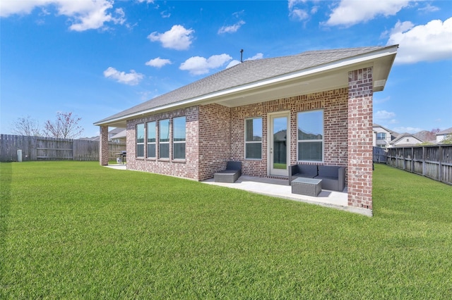 15534 Ponderosa Bend Dr, Cypress, TX 77429 - rear view of house featuring a fenced backyard, brick siding, a yard, and a patio