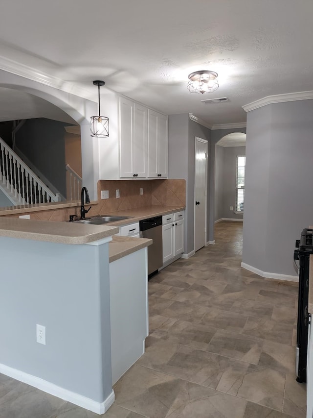 kitchen featuring stainless steel dishwasher, a sink, arched walkways, backsplash, and white cabinetry