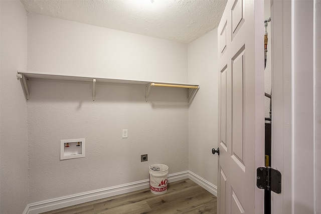 559 Doty Rd, Vidor, TX 77662 - laundry room featuring wood finished floors, hookup for an electric dryer, baseboards, laundry area, and washer hookup