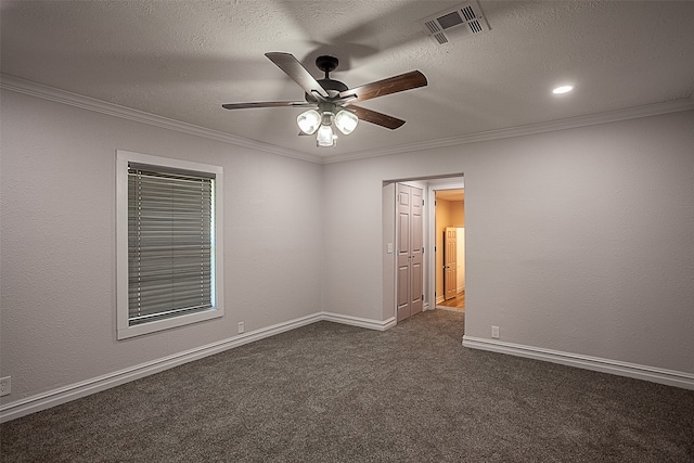 559 Doty Rd, Vidor, TX 77662 - unfurnished room with dark carpet, visible vents, crown molding, a textured ceiling, and ceiling fan