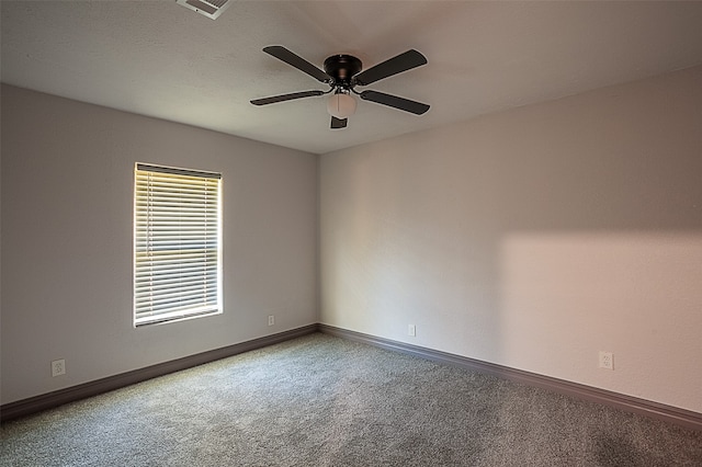 559 Doty Rd, Vidor, TX 77662 - unfurnished room featuring visible vents, carpet flooring, baseboards, and a ceiling fan