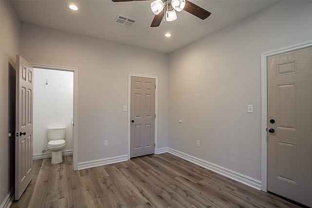 559 Doty Rd, Vidor, TX 77662 - interior space featuring recessed lighting, wood finished floors, visible vents, ensuite bath, and baseboards