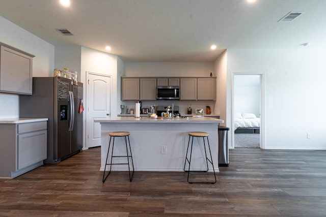24737 Mountain Tree Dr, Magnolia, TX 77355 - kitchen with recessed lighting, visible vents, gray cabinets, and stainless steel appliances