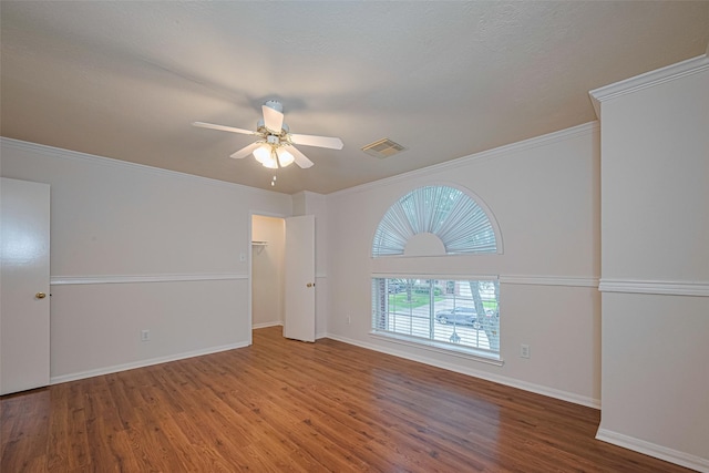 215 Pebble Canyon Ln, Dickinson, TX 77539 - empty room featuring wood finished floors, ceiling fan, baseboards, and ornamental molding