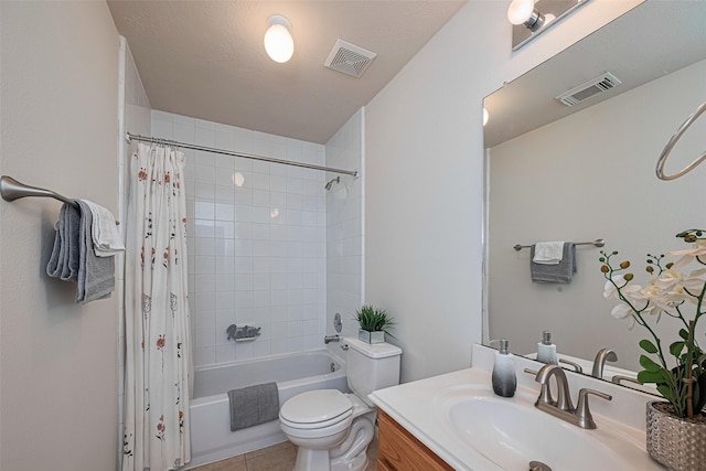 215 Pebble Canyon Ln, Dickinson, TX 77539 - full bathroom featuring vanity, shower / bath combo with shower curtain, toilet, and tile patterned floors
