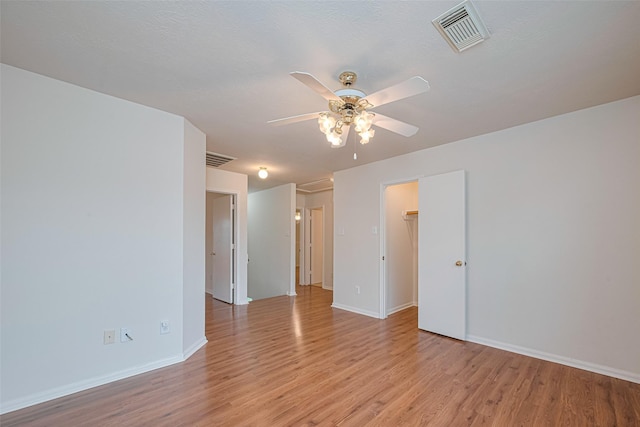 215 Pebble Canyon Ln, Dickinson, TX 77539 - unfurnished room featuring ceiling fan, light wood-type flooring, and baseboards
