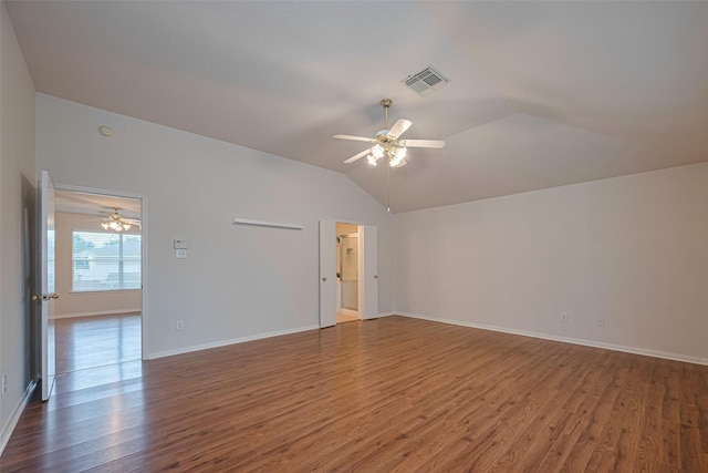 215 Pebble Canyon Ln, Dickinson, TX 77539 - empty room featuring ceiling fan, vaulted ceiling, wood finished floors, and baseboards