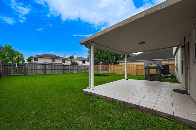 215 Pebble Canyon Ln, Dickinson, TX 77539 - view of yard featuring a patio area and a trampoline