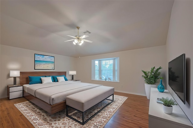 215 Pebble Canyon Ln, Dickinson, TX 77539 - bedroom featuring wood finished floors, baseboards, vaulted ceiling, and ceiling fan