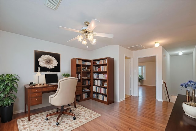 215 Pebble Canyon Ln, Dickinson, TX 77539 - office featuring wood finished floors, baseboards, and a ceiling fan