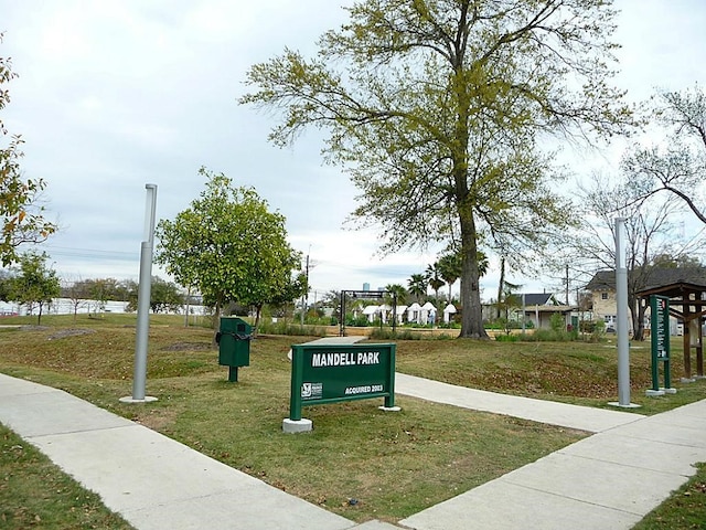 view of home's community with a yard