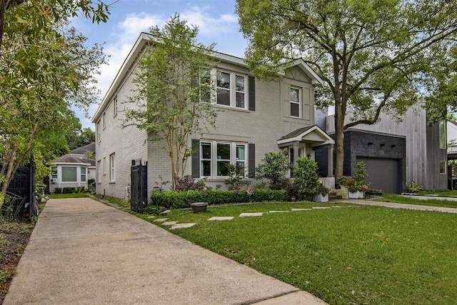 view of front facade with brick siding, a garage, driveway, and a front lawn