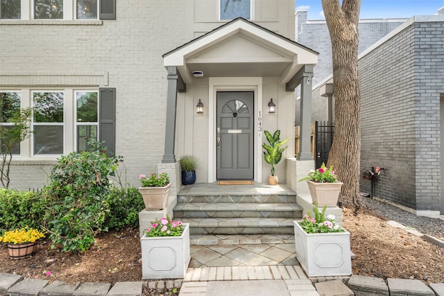 entrance to property with brick siding