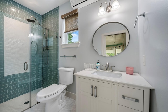 bathroom with tile patterned flooring, vanity, toilet, and a shower stall
