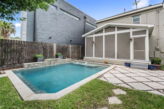 view of pool with a sunroom, a fenced backyard, and a fenced in pool