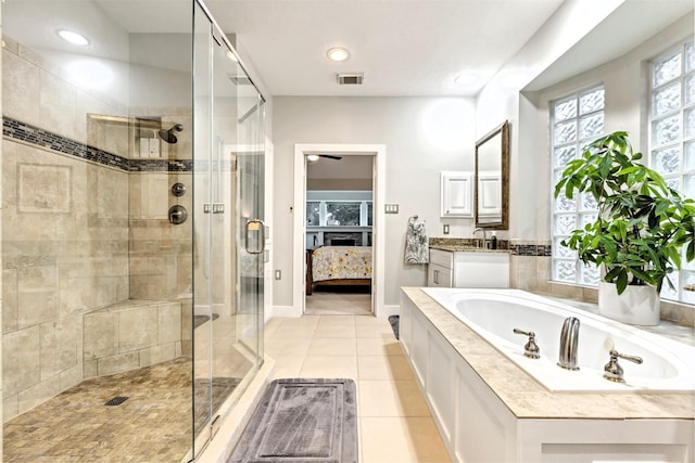 ensuite bathroom with tile patterned flooring, ensuite bath, visible vents, a bath, and a stall shower