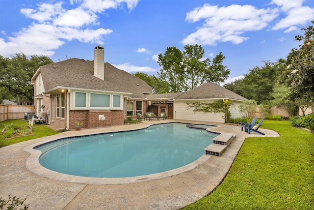 view of swimming pool with a yard, fence, a patio area, and a fenced in pool