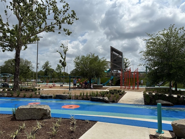 view of basketball court with playground community