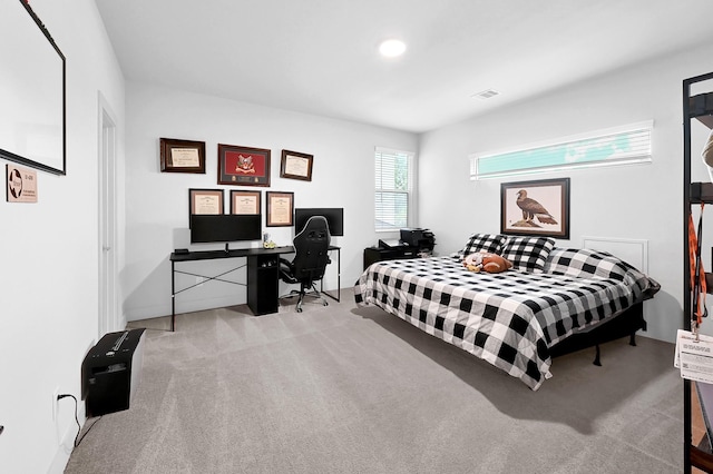 bedroom with recessed lighting, light colored carpet, and visible vents