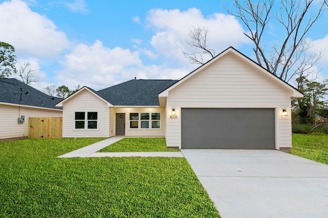 8009 Bigwood St, Houston, TX 77078 - view of front of property with concrete driveway, an attached garage, and a shingled roof