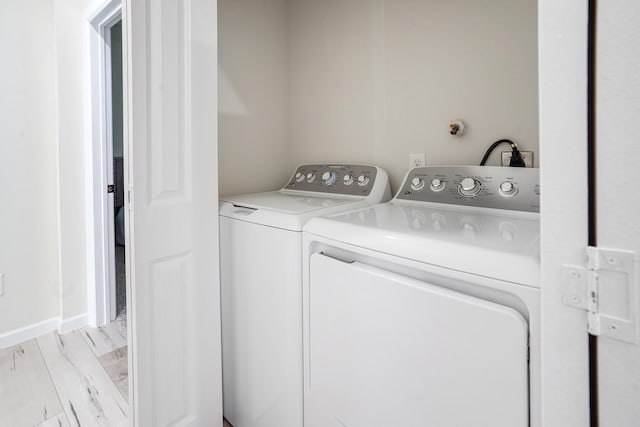 laundry room featuring washer and dryer and laundry area
