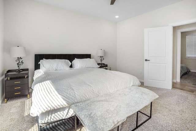 bedroom featuring recessed lighting, baseboards, a ceiling fan, and light colored carpet