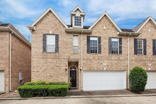 2842 Briarhurst Park, Houston, TX 77057 - view of property with a garage, brick siding, and concrete driveway
