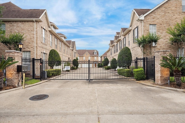 2842 Briarhurst Park, Houston, TX 77057 - view of road with a gated entry, curbs, and a gate