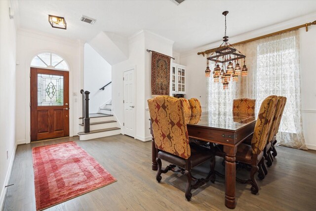 2842 Briarhurst Park, Houston, TX 77057 - dining room featuring wood finished floors, visible vents, a notable chandelier, and stairway
