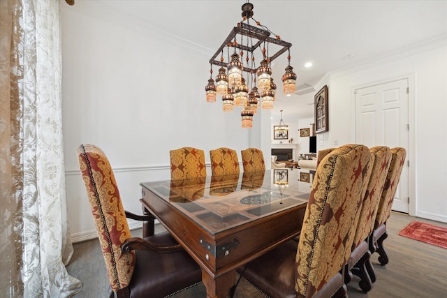 2842 Briarhurst Park, Houston, TX 77057 - dining room featuring a fireplace, wood finished floors, baseboards, and ornamental molding