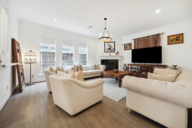 2842 Briarhurst Park, Houston, TX 77057 - living room with a glass covered fireplace, dark wood finished floors, a chandelier, and crown molding